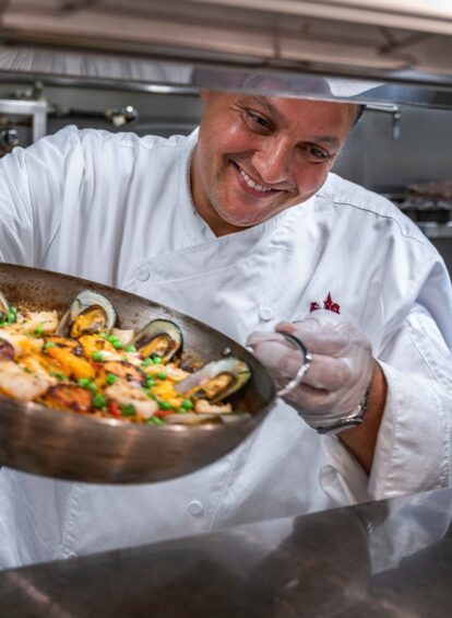 chef placing a dish on the counter