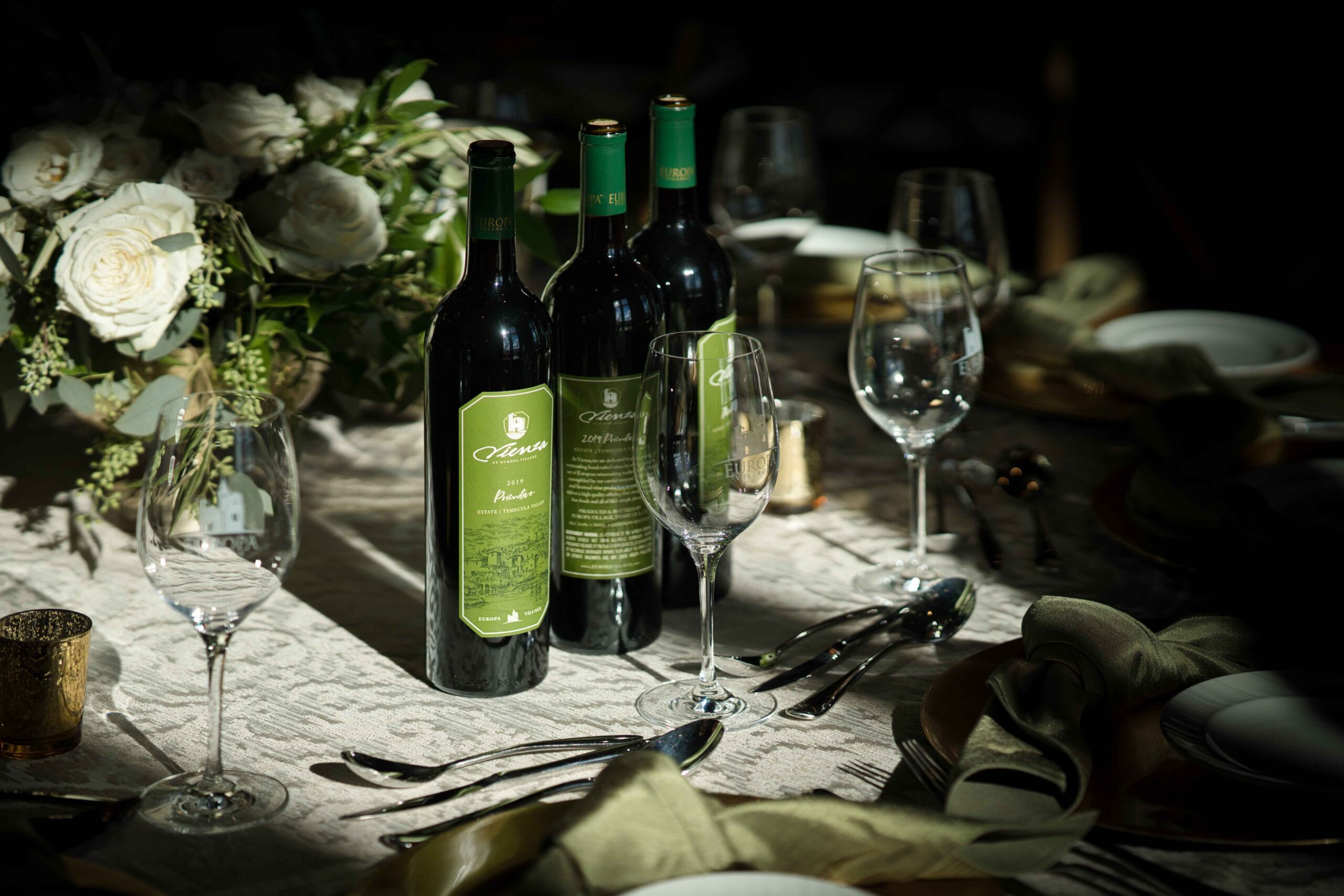 wine and wine glasses with roses